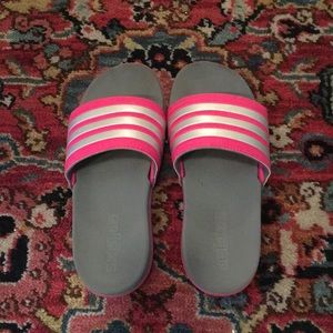 Adidas pink and silver slip on sandals.